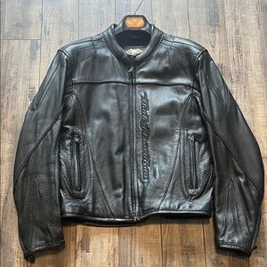 Vintage Harley-Davidson Black Leather Motorcycle Jacket with embroidered logos.